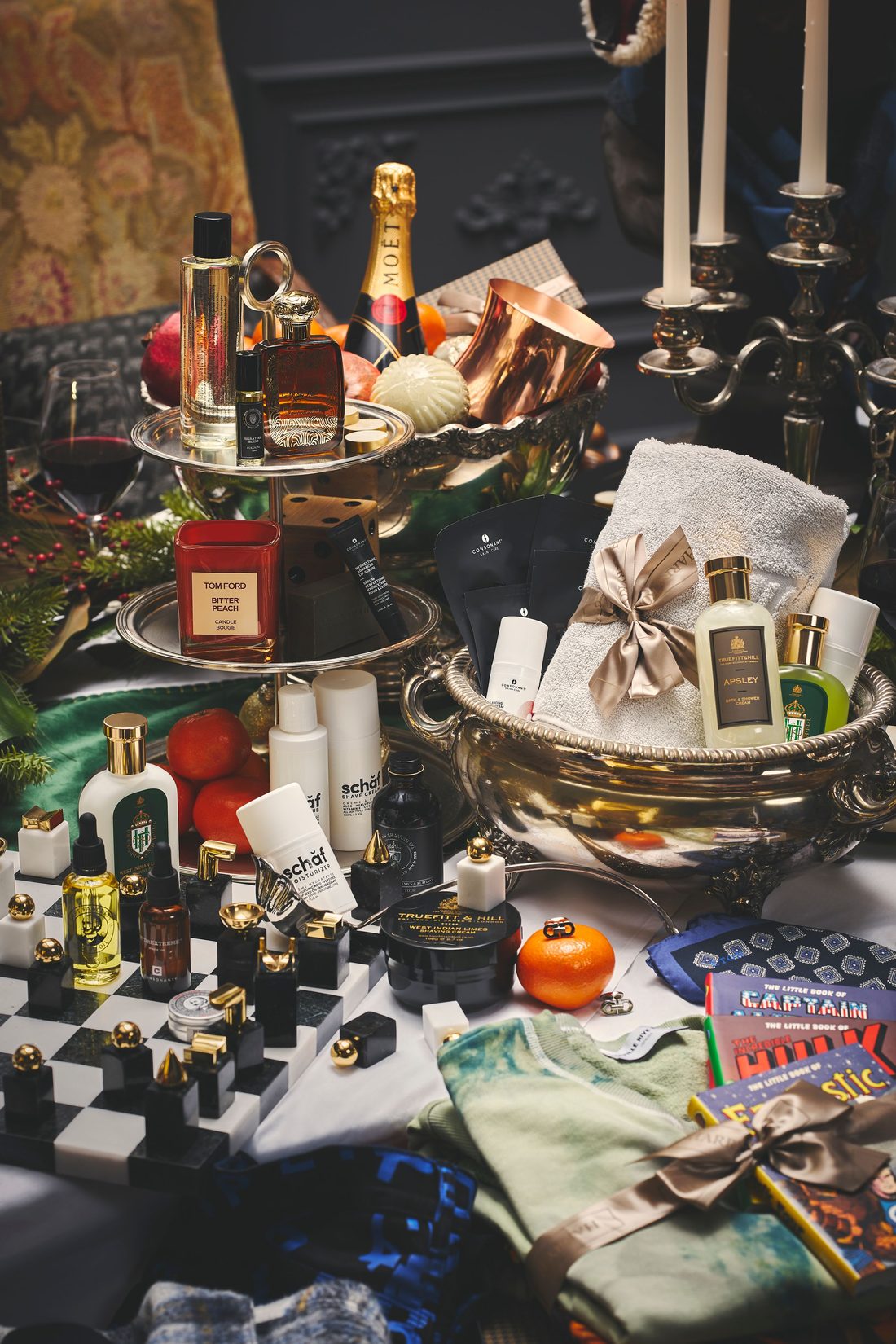 Holiday gift flat lay of grooming and leisure products, styled off-figure