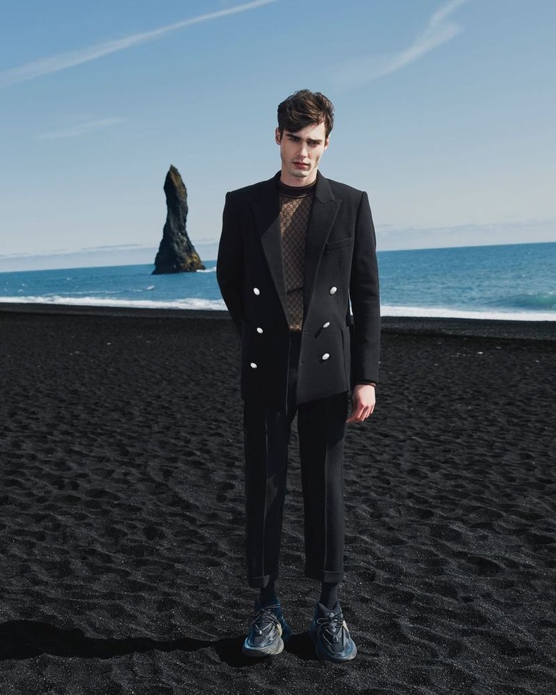 Balmain knitwear photographed on a black sand beach in Iceland, Fall 2023