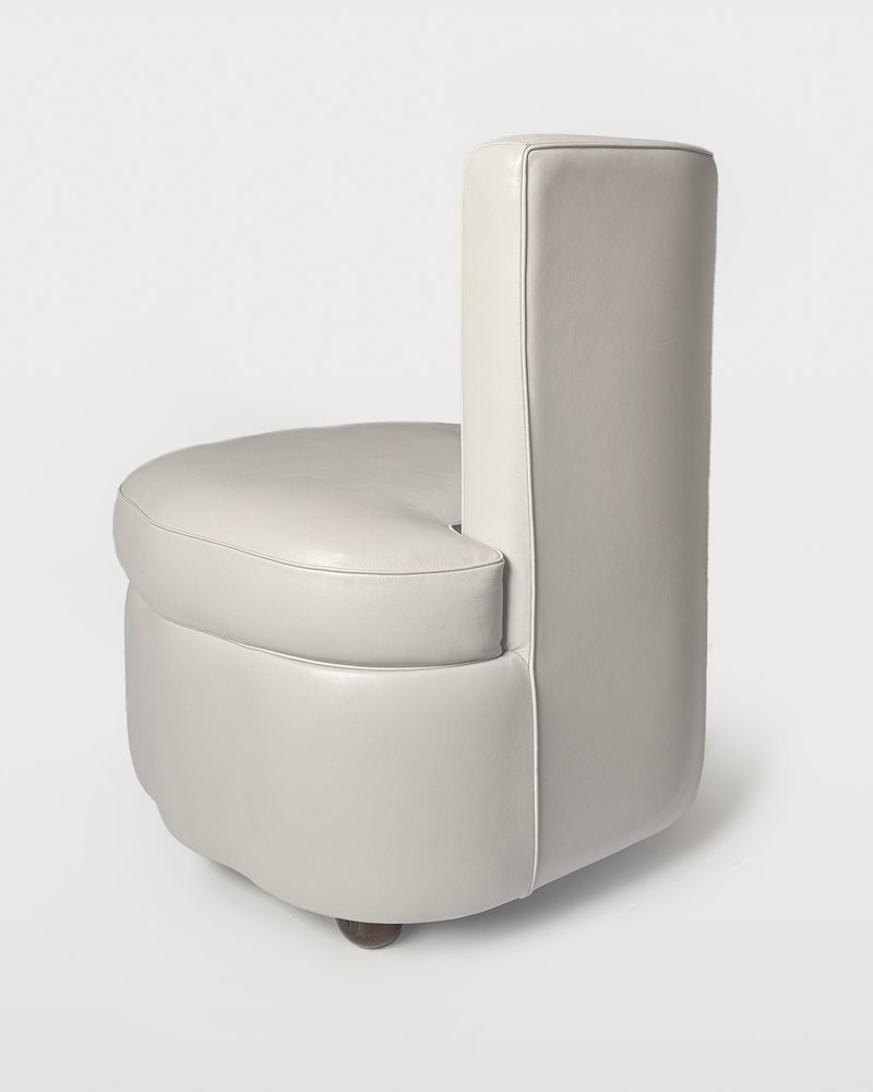 Poltrona Frau leather armchair photographed off-figure on seamless white