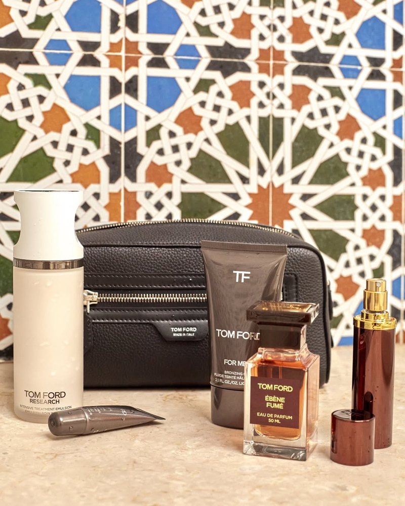 Tom Ford fragrance and grooming products styled off-figure on patterned tile