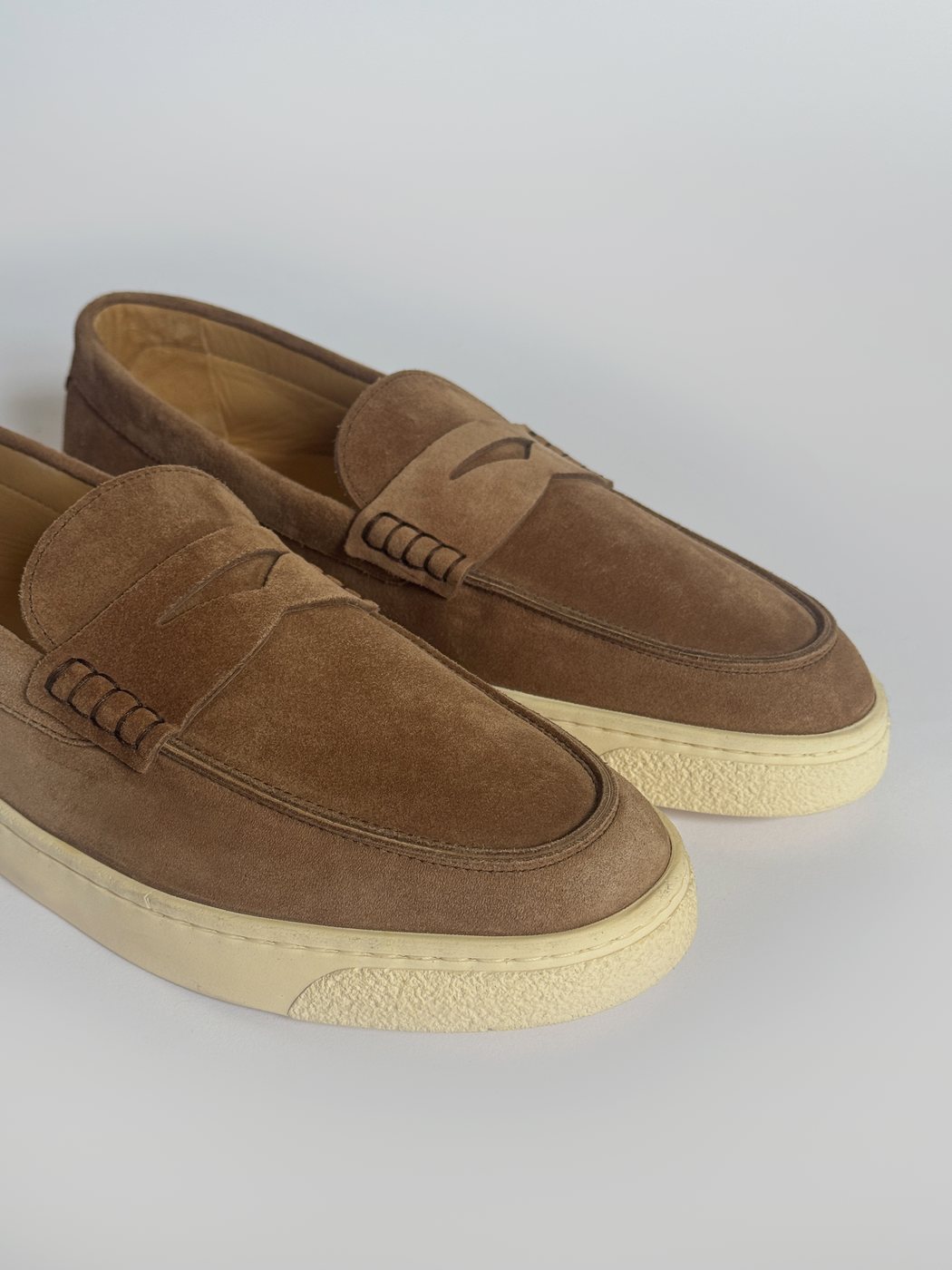 Brunello Cucinelli suede loafers photographed off-figure for eCommerce