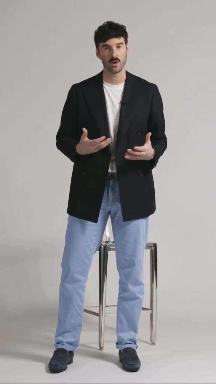 Andrew Chitty presenting Brax trousers on camera for a paid social ad
