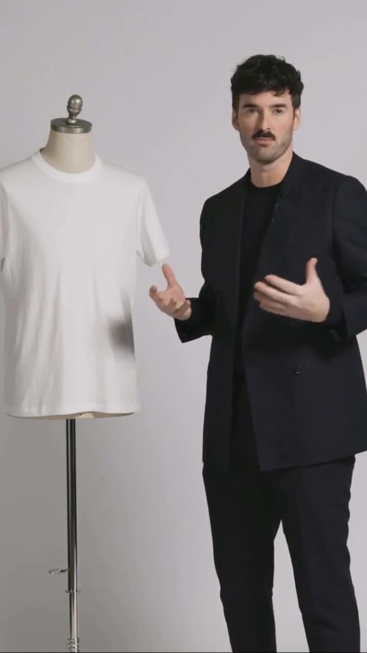 Andrew Chitty presenting a Patrick Assaraf tee on camera for a paid social ad